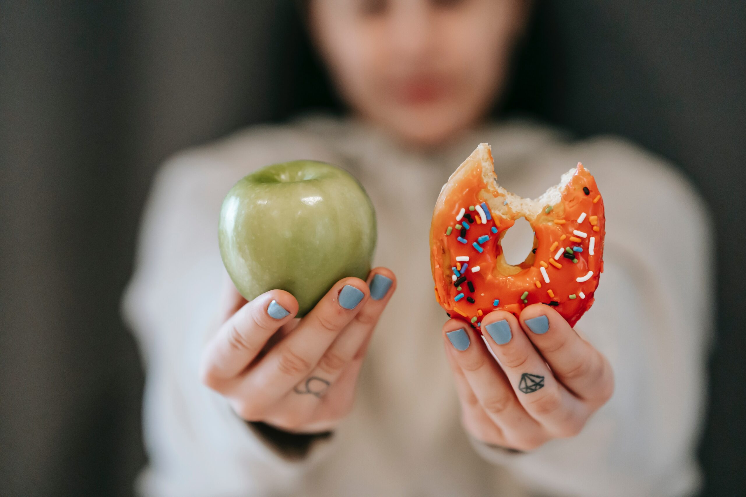 holding-an-apple-and-a-donut